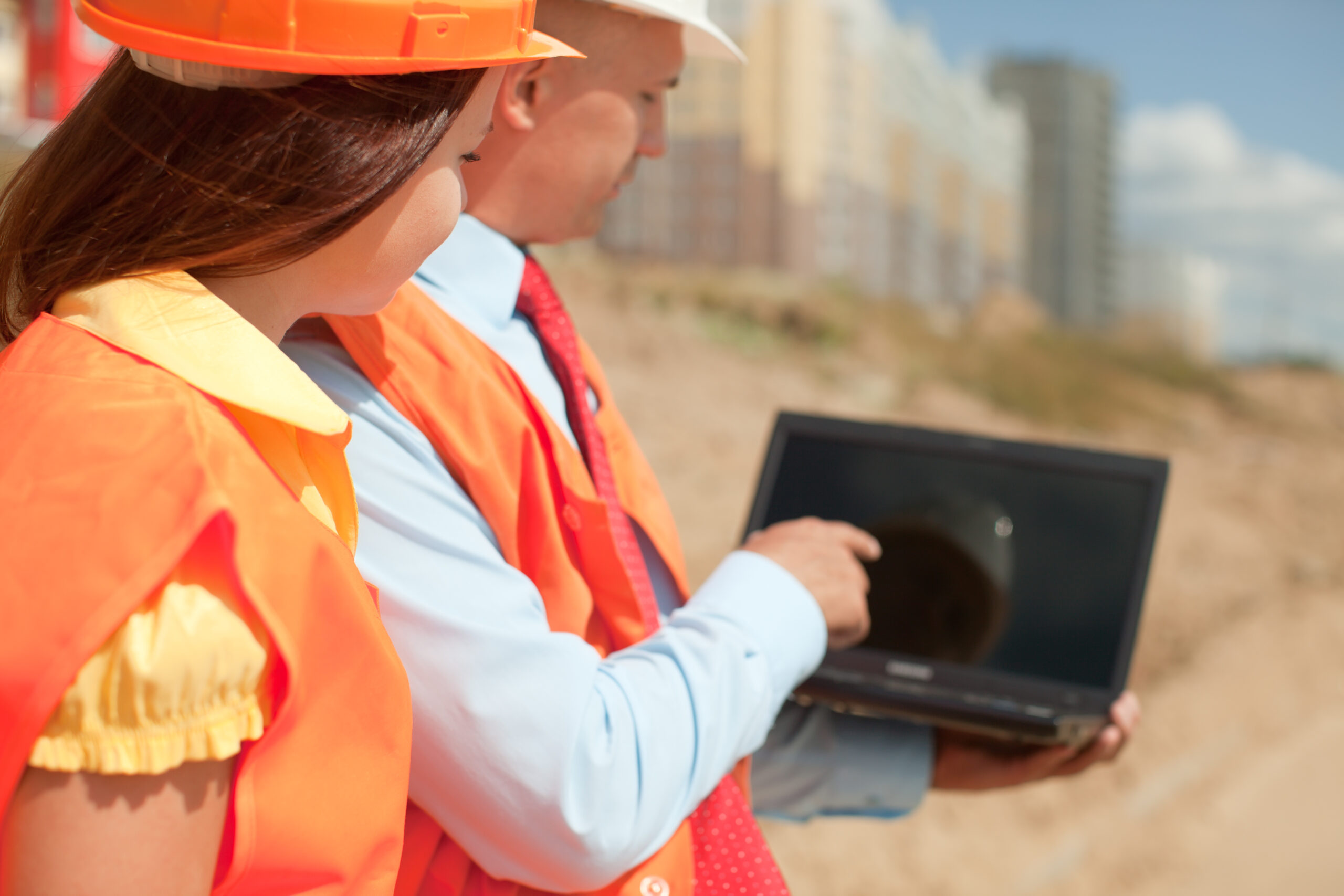 Surveying company professionals reviewing data.