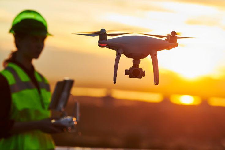 Drones for surveying operator at sunset